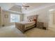 Main bedroom featuring a ceiling fan, natural light and a view of the backyard at 1765 Pinetree Pass Lane Southwest Sw Ln, Lilburn, GA 30047
