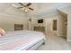 Primary bedroom featuring a vaulted ceiling, TV, and lots of natural light at 1765 Pinetree Pass Lane Southwest Sw Ln, Lilburn, GA 30047