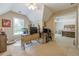 Well-lit home office space featuring a window, desk, and view into the primary bedroom at 1765 Pinetree Pass Lane Southwest Sw Ln, Lilburn, GA 30047