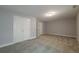 Spacious unfinished basement featuring neutral walls, carpet, and double door closet at 2264 Ewell Park Dr, Lawrenceville, GA 30043