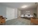 Finished basement featuring neutral walls, carpet, game tables, and modern sofa at 2264 Ewell Park Dr, Lawrenceville, GA 30043