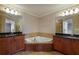 Bathroom with separate vanities and a jacuzzi tub in the middle at 2264 Ewell Park Dr, Lawrenceville, GA 30043