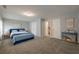 Large bedroom with windows, a bed, and a small table at 2264 Ewell Park Dr, Lawrenceville, GA 30043