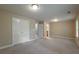 Spacious bedroom with ample natural light, complemented by neutral walls and plush carpet at 2264 Ewell Park Dr, Lawrenceville, GA 30043