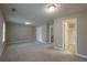 A spacious bedroom with neutral paint colors, plush carpeting and recessed lighting at 2264 Ewell Park Dr, Lawrenceville, GA 30043