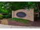 Elegant brick community sign for Ewell Parc, accented with colorful flowers and landscaping at 2264 Ewell Park Dr, Lawrenceville, GA 30043