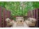Relaxing outdoor deck area complete with furniture, ideal for enjoying nature at 2264 Ewell Park Dr, Lawrenceville, GA 30043