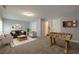 A game room with a couch, foosball table, and dart board at 2264 Ewell Park Dr, Lawrenceville, GA 30043