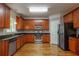 Beautiful kitchen with stainless appliances, wood cabinets and hardwood floors at 2264 Ewell Park Dr, Lawrenceville, GA 30043