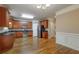 Well-appointed kitchen with stainless steel appliances, black countertops, and hardwood floors at 2264 Ewell Park Dr, Lawrenceville, GA 30043