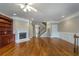 Spacious living room with hardwood floors, a fireplace, and a staircase leading to the upper level at 2264 Ewell Park Dr, Lawrenceville, GA 30043
