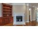 Beautiful living room featuring a fireplace and custom wood built-ins at 2264 Ewell Park Dr, Lawrenceville, GA 30043
