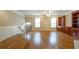 Spacious living room with hardwood floors, fireplace, and built in bookcase at 2264 Ewell Park Dr, Lawrenceville, GA 30043