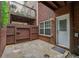 Stone patio featuring a privacy fence and backdoor entrance to the home at 2264 Ewell Park Dr, Lawrenceville, GA 30043