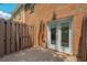 Enclosed patio with wooden floors and privacy fence, offering a secluded outdoor space at 2264 Ewell Park Dr, Lawrenceville, GA 30043