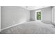Bright, neutral bedroom with a large window and plenty of space for furniture and personal touches at 23307 Plantation Ne Dr, Atlanta, GA 30324