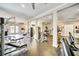 Community gym featuring cardio and weight training equipment, with rubber flooring and ceiling fans at 23307 Plantation Ne Dr, Atlanta, GA 30324