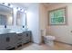 Contemporary bathroom features double vanity sinks, modern fixtures, and a bright, clean design at 4396 Greenleaf Cir, Atlanta, GA 30331
