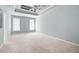 Spacious bedroom with tray ceiling, plush carpet, and double windows at 795 Lake Medlock Dr, Alpharetta, GA 30022
