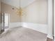 Spacious dining room featuring carpeted floors, white trim, and an elegant chandelier at 795 Lake Medlock Dr, Alpharetta, GA 30022