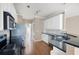 Well-equipped kitchen boasts granite counters, stainless steel appliances, and ample white cabinetry at 795 Lake Medlock Dr, Alpharetta, GA 30022