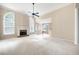 Bright and airy living room with carpeted floors, a fireplace, and large windows at 795 Lake Medlock Dr, Alpharetta, GA 30022