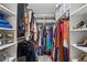 Spacious walk-in closet featuring built-in shelves and racks to organize clothing and shoes at 2900 Townley Cir, Atlanta, GA 30340