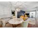 Dining area with decorative lighting, accent wall, and contemporary furnishings at 2900 Townley Cir, Atlanta, GA 30340