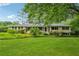 Charming ranch-style home with well-manicured front yard and lush landscaping at 2900 Townley Cir, Atlanta, GA 30340