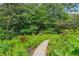 A picturesque pathway winding through the lush gardens with colorful flowers and vibrant greenery at 2900 Townley Cir, Atlanta, GA 30340
