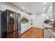 Well-lit kitchen with granite countertops, stainless steel refrigerator, and stylish backsplash at 2900 Townley Cir, Atlanta, GA 30340