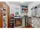 Laundry room features new washer and dryer, built in storage with decorative shelf, and tile floors at 2900 Townley Cir, Atlanta, GA 30340