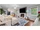 Bright, open-concept living area with fireplace, hardwood floors, and natural light at 2900 Townley Cir, Atlanta, GA 30340