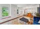 Sunlit living room featuring hardwood floors, built-in cabinets, and stylish decor at 2900 Townley Cir, Atlanta, GA 30340