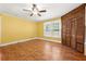 Bright bedroom featuring a ceiling fan, tile floors, and built-in closet at 3956 Tell Sw Rd, Atlanta, GA 30331
