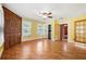 Spacious bedroom with hardwood floors, bright walls, and a ceiling fan at 3956 Tell Sw Rd, Atlanta, GA 30331