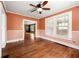 Bright dining room featuring hardwood floors, neutral paint, and a ceiling fan at 3956 Tell Sw Rd, Atlanta, GA 30331