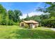 Beautifully landscaped front yard with a cozy, one-story home at 3956 Tell Sw Rd, Atlanta, GA 30331
