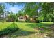 Charming home featuring a large front lawn and mature trees providing shade and privacy at 3956 Tell Sw Rd, Atlanta, GA 30331