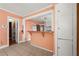 Eat-in kitchen featuring a breakfast bar, tile floors, and white trim at 3956 Tell Sw Rd, Atlanta, GA 30331