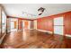 Large living room with hardwood floors, ceiling fan, access to other rooms, and natural light at 3956 Tell Sw Rd, Atlanta, GA 30331