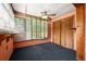 Inviting sun room with plush carpeting, natural light, and wood accents, perfect for relaxing at 3956 Tell Sw Rd, Atlanta, GA 30331
