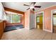 Bright sun room featuring tile floors, a ceiling fan, and large windows offering plenty of natural light at 3956 Tell Sw Rd, Atlanta, GA 30331