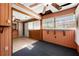 Cozy sun room featuring tile floors, wood paneling, and large windows, ideal for a sitting area at 3956 Tell Sw Rd, Atlanta, GA 30331