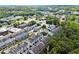A neighborhood of well-maintained homes sits among tall trees in this aerial view at 420 Banbury Xing, Alpharetta, GA 30009