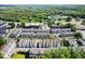 An aerial view of the neighborhood displaying the community layout, trees, and nearby amenities at 420 Banbury Xing, Alpharetta, GA 30009
