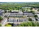An aerial view of a community featuring orderly streets, tree-lined sidewalks, and landscaping at 420 Banbury Xing, Alpharetta, GA 30009