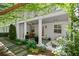 Relaxing back porch with seating, outdoor dining, and decorative plants at 420 Banbury Xing, Alpharetta, GA 30009
