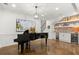 Basement with wet bar, brickwork, grand piano, and open space at 420 Banbury Xing, Alpharetta, GA 30009