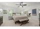 Bright bedroom featuring neutral decor, ceiling fan, and natural light from shuttered windows at 420 Banbury Xing, Alpharetta, GA 30009